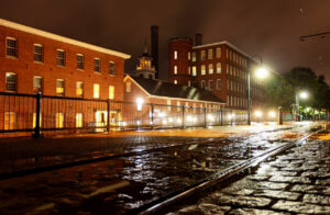 Historic Lowell, Massachusetts at night. Lowell is known as the cradle of the industrial revolution in the United States and many of the city's historic sites have been preserved by the National Park Service.